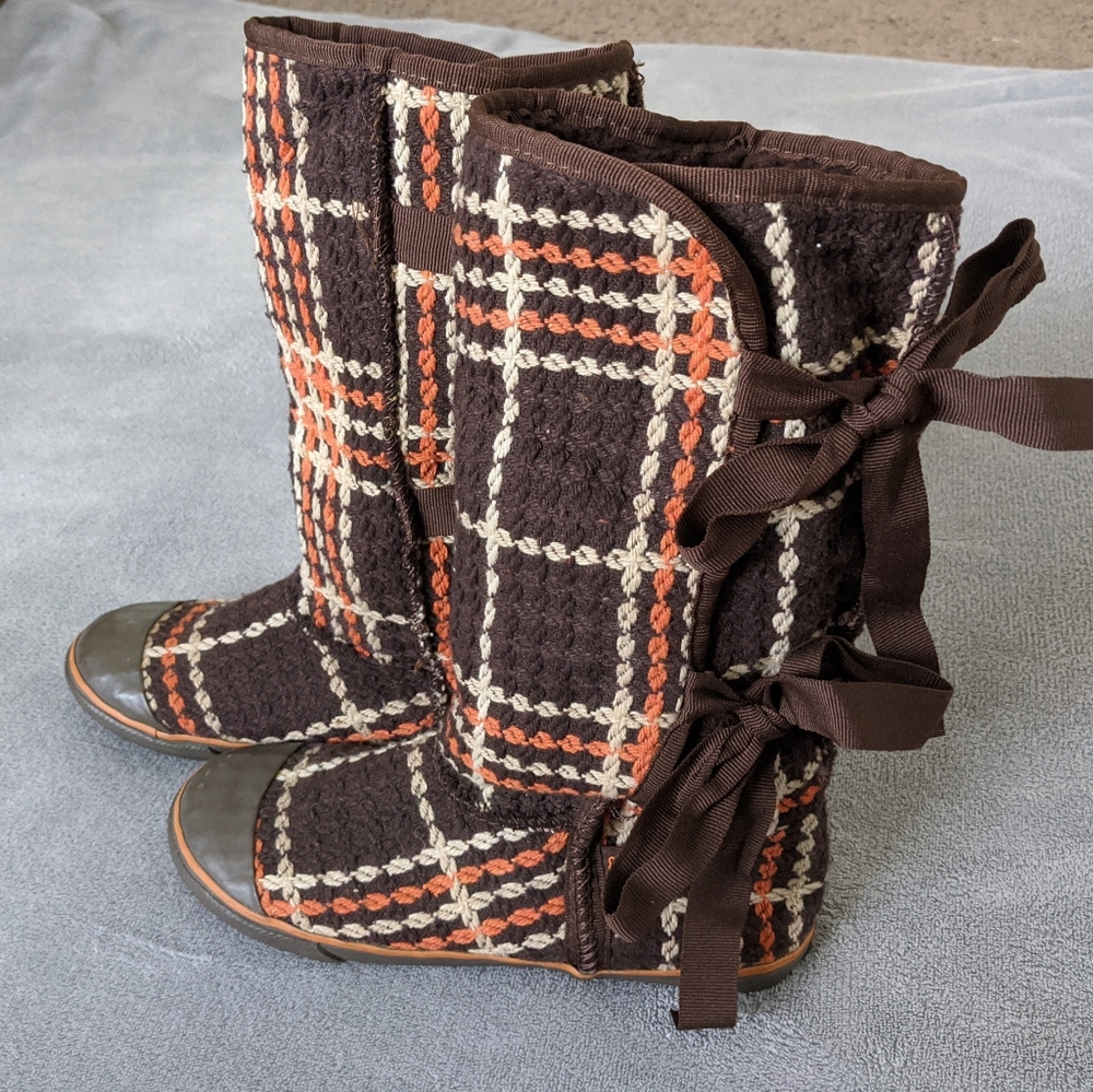 Unique boots with ribbon ties.